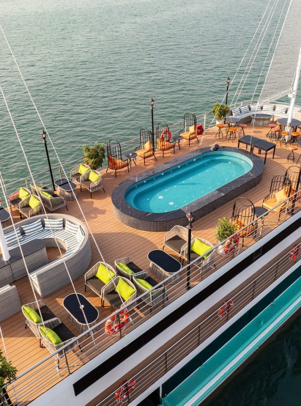 Stunning Halong Bay cruise balcony with panoramic views and luxurious amenities.