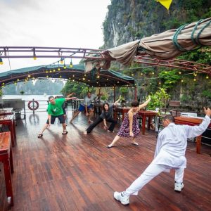 bai-tu-long-cruise-tai-chi-sundeck-limestone-cliffs-viettrendtour
