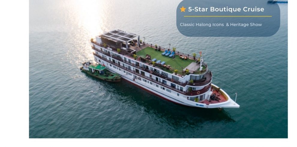 Luxury cruise ship in Halong Bay offering private tours and heritage shows.