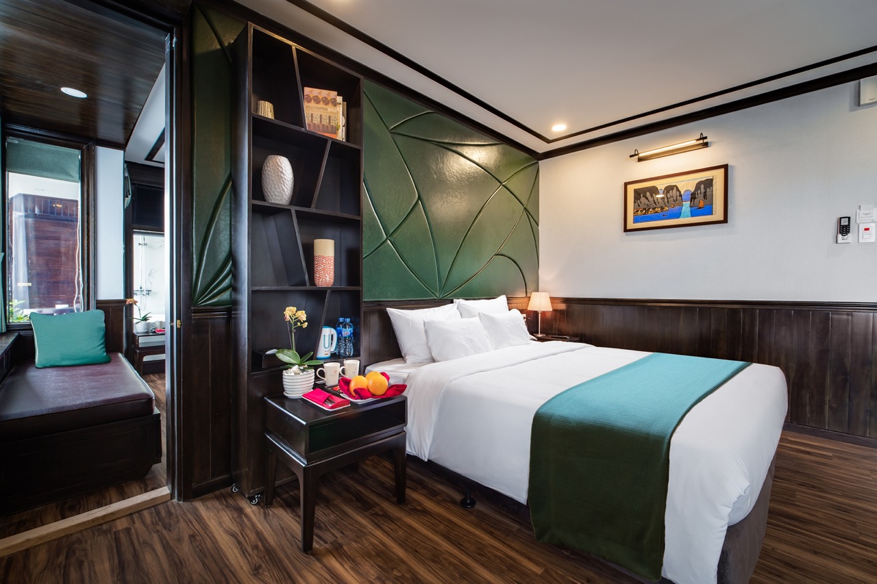 Elegant cruise balcony with scenic views of Halong Bay, perfect for a romantic getaway.