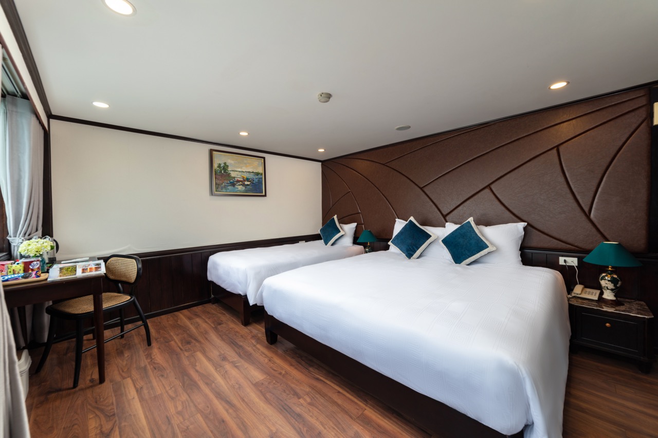 Comfortable hotel room with modern decor, cozy beds, and elegant furnishings for a relaxing stay.