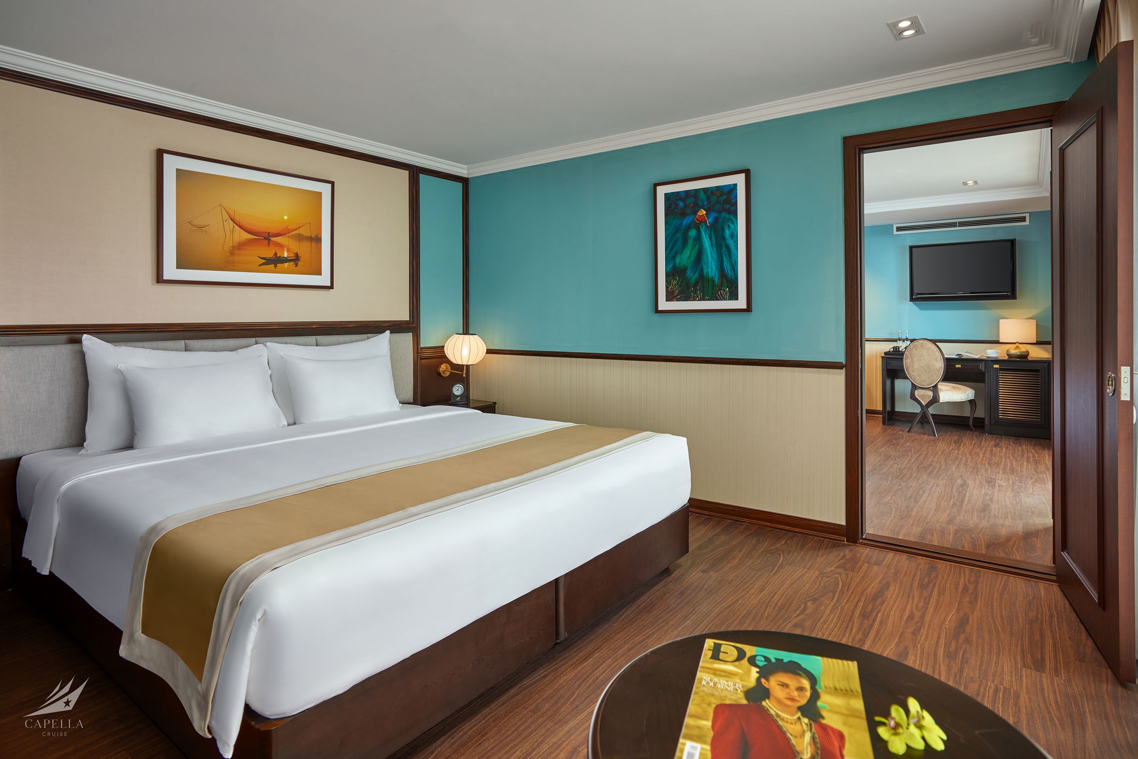 Comfortable hotel room with modern decor, cozy king bed, and workspace for travelers.