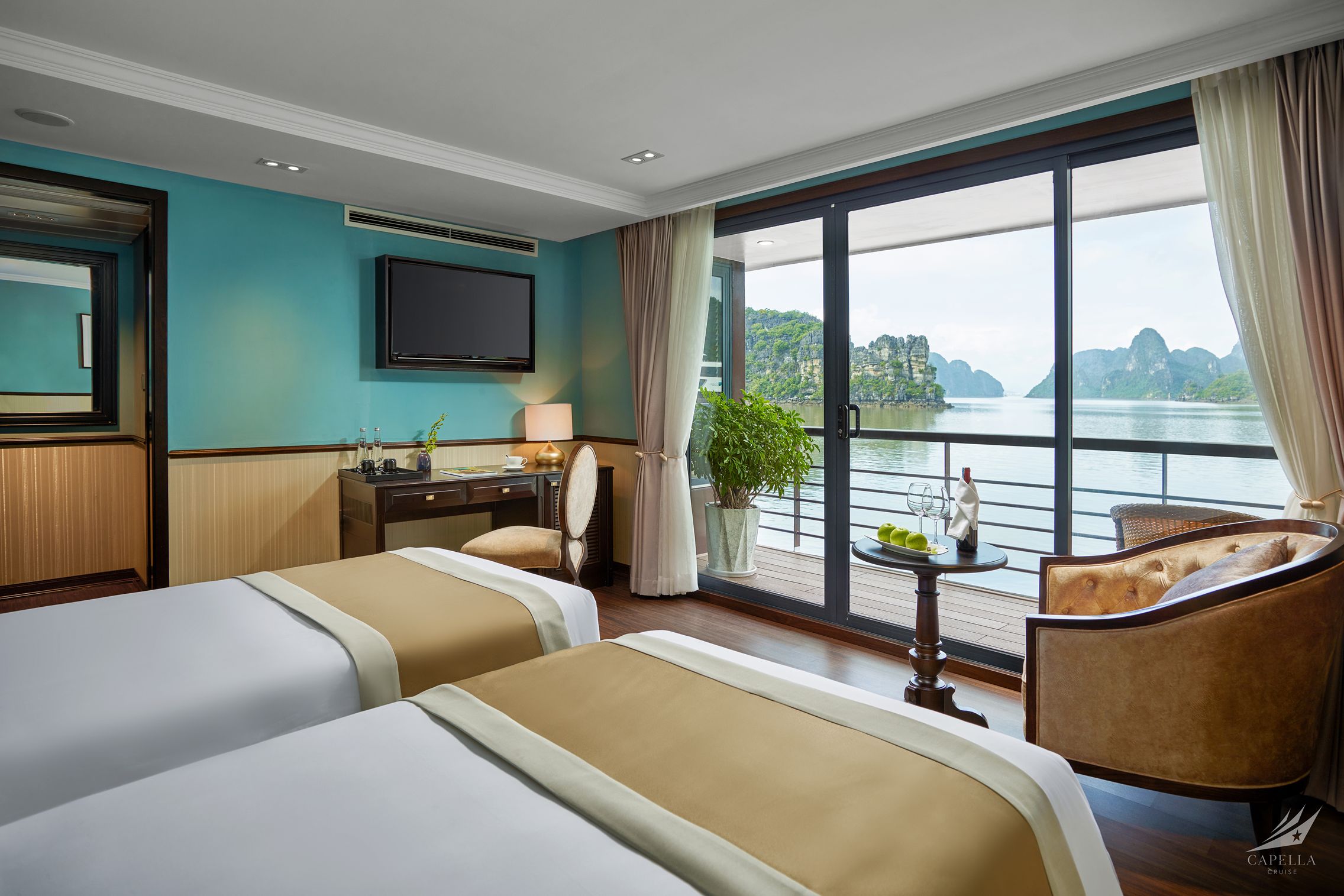 Luxury river view hotel room with balcony, modern amenities and scenic natural surroundings.