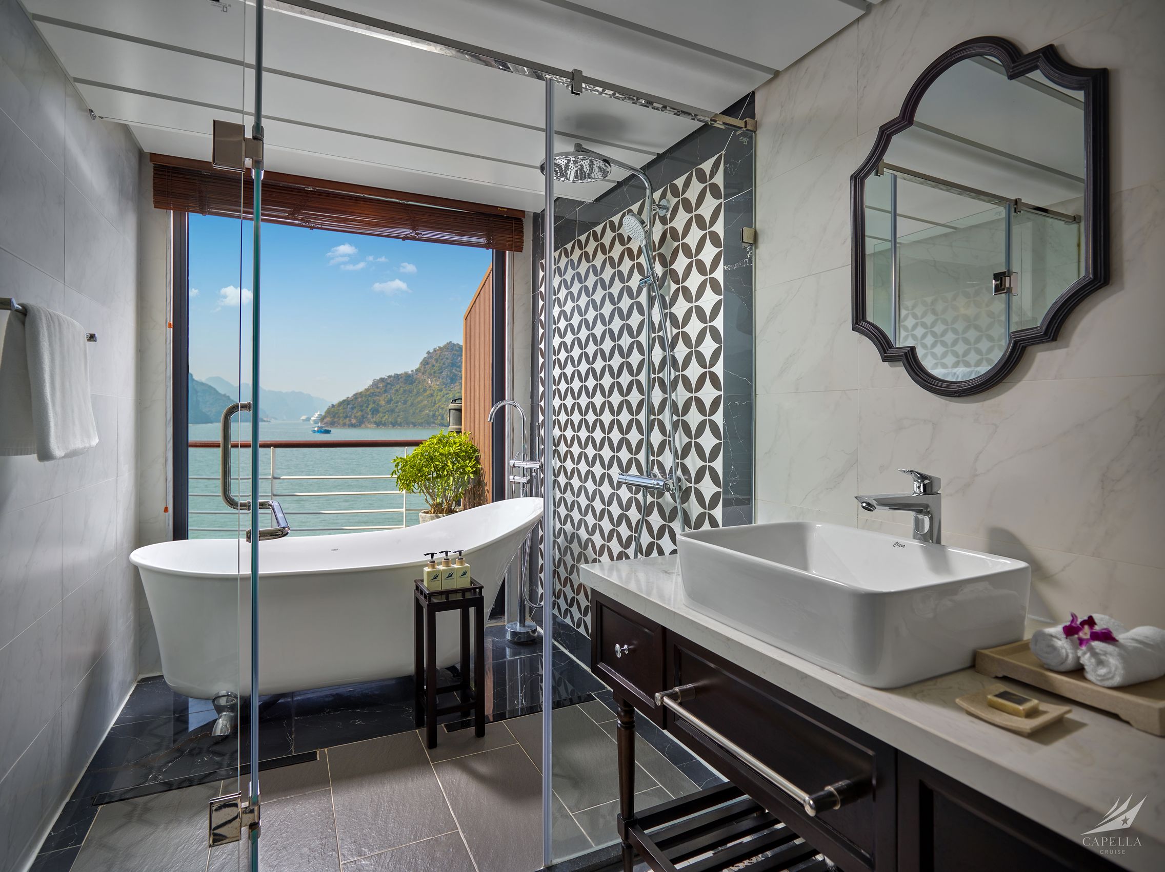 Exquisite bathroom with bathtub and mountain view in a luxury hotel room.