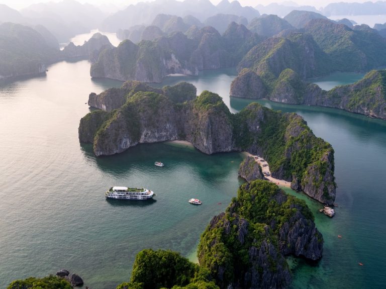 Stunning view of limestone karsts and emerald waters in Halong Bay during a cruise.