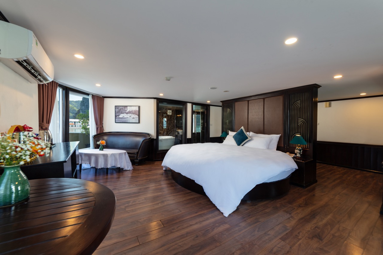 Luxurious hotel bedroom with modern design and wood flooring, perfect for relaxing stays.
