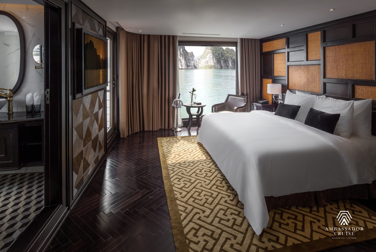 Elegant cruise balcony view of Halong Bay with serene waters and lush islands, perfect for a relaxin.