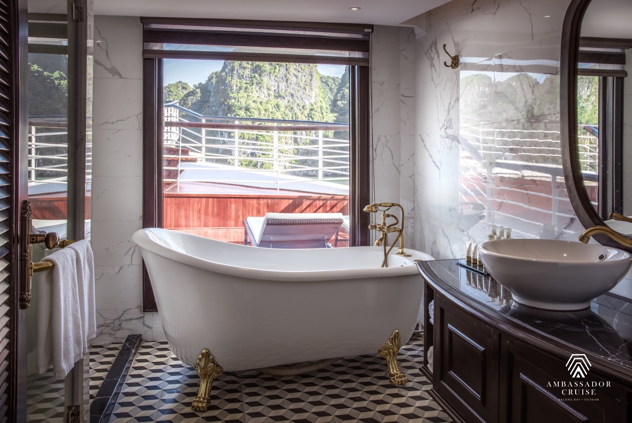 Elegant bathroom with scenic Halong Bay view, perfect for a luxurious cruise experience.