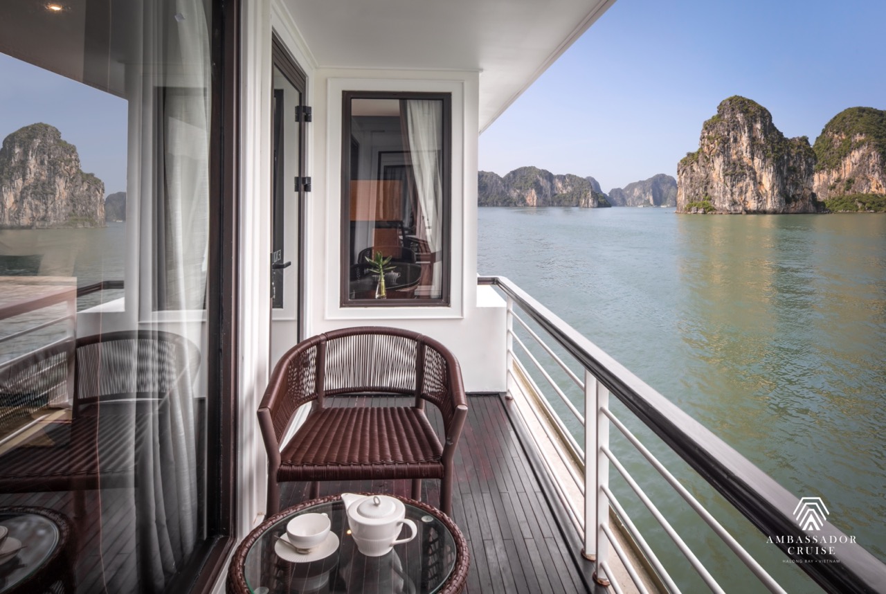 Stunning view from cruise balcony in Halong Bay, perfect for relaxing and enjoying the scenic limest.