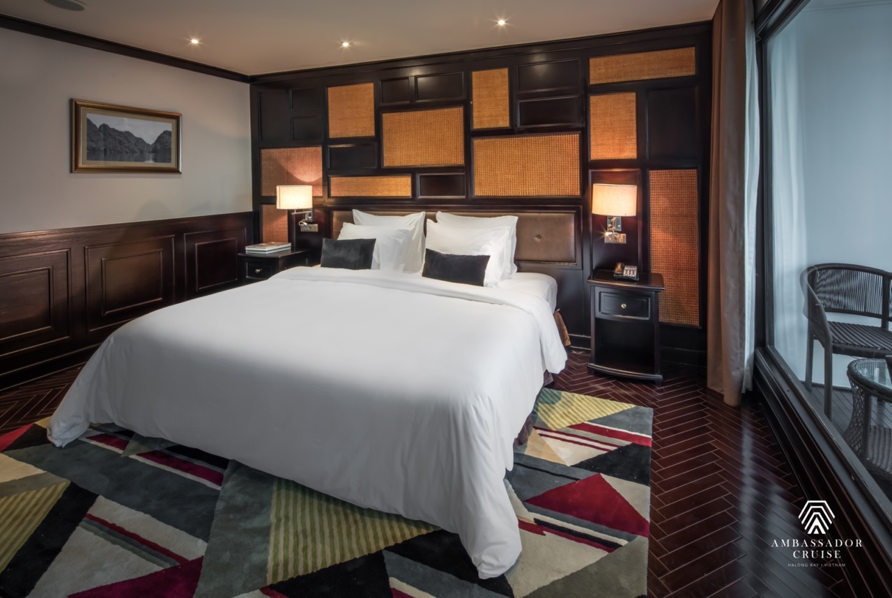 Luxurious cruise room featuring contemporary design, cozy bedding, and scenic bay vistas for a memor.