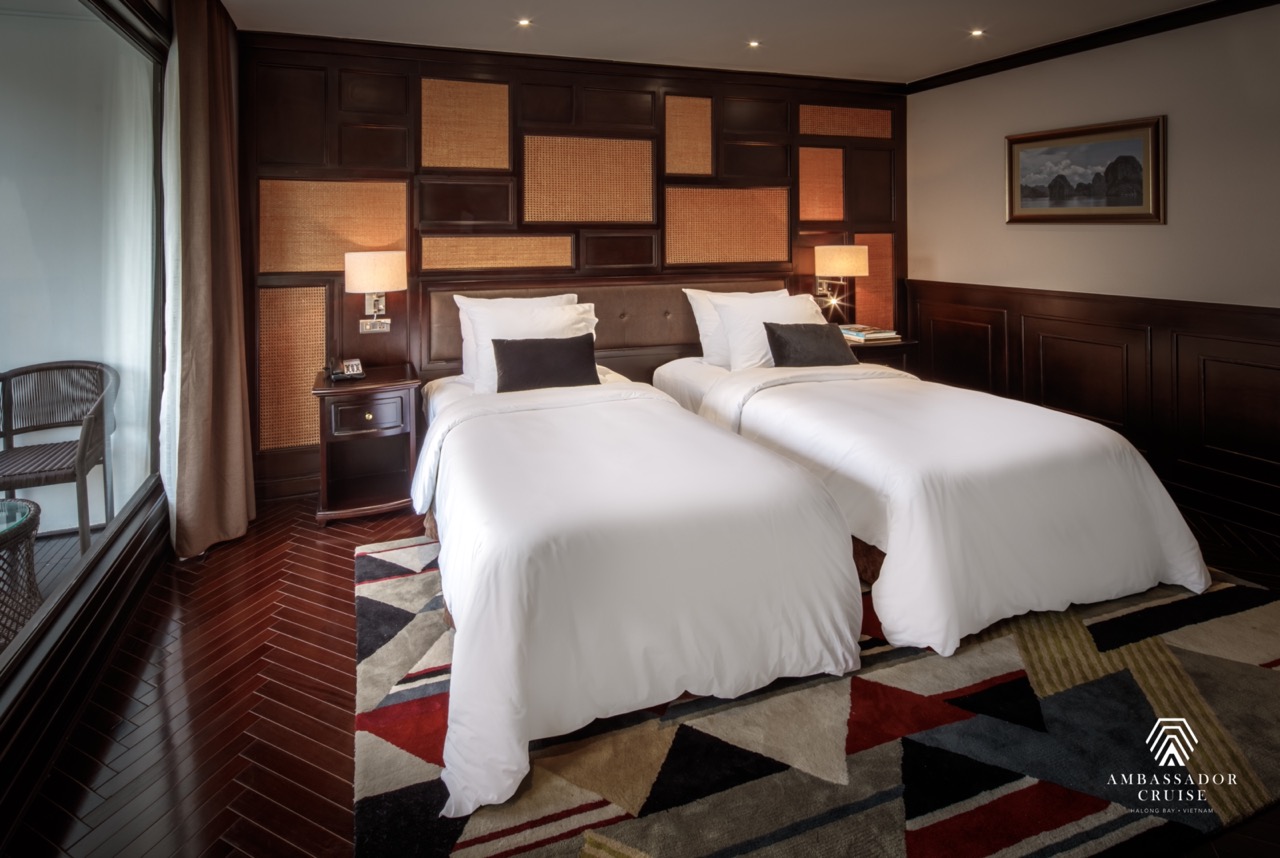 Elegant cruise balcony with stunning views of Halong Bay, perfect for a memorable 2-night voyage.