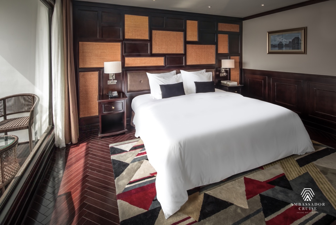 Elegant cruise balcony view of Halong Bay with serene waters and towering limestone karsts. Perfect.