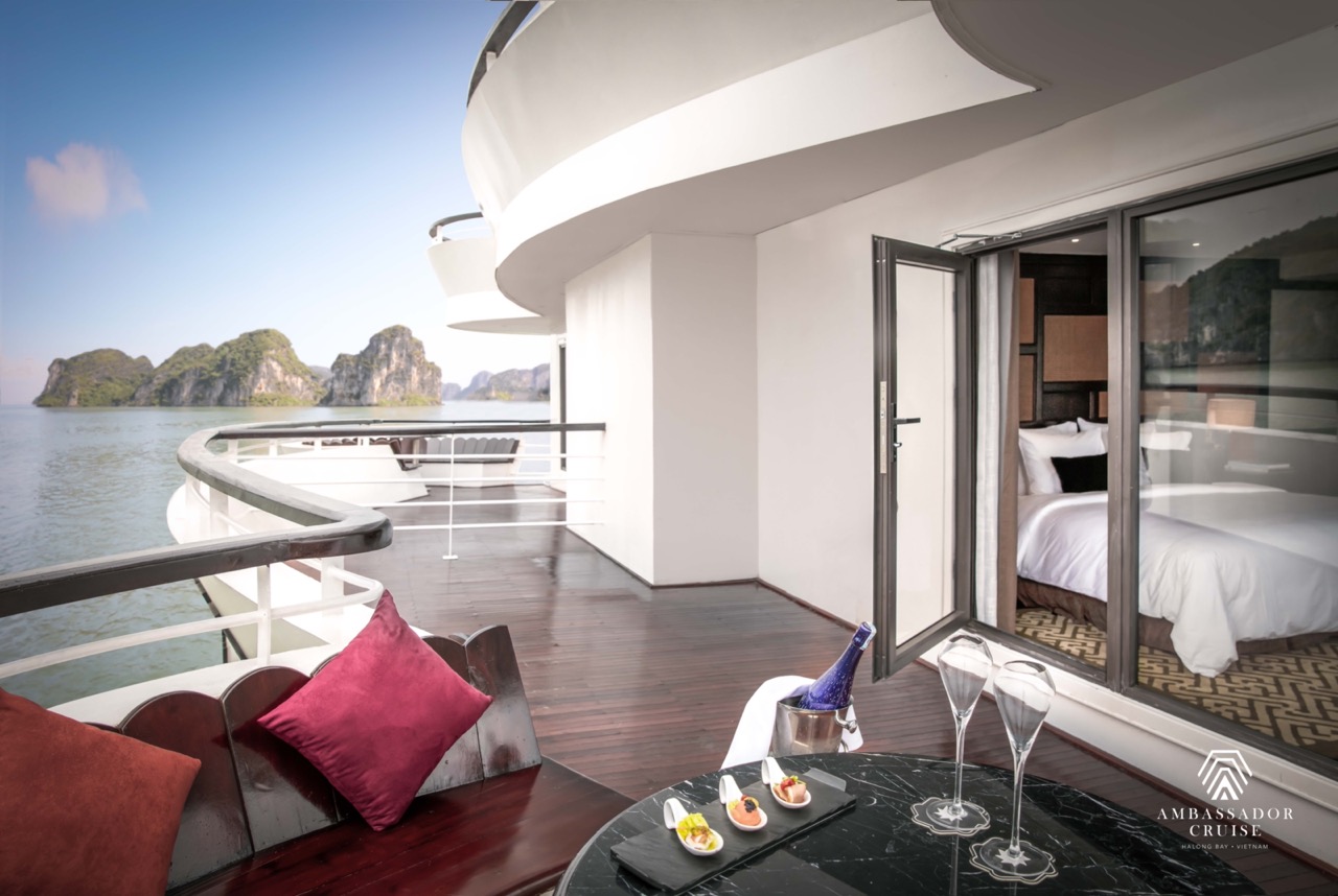 Luxurious cruise balcony overlooking Halong Bay with stunning seascape and serene atmosphere.