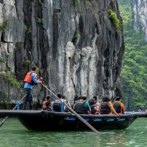 bamboo-boat-luon-cave-cliffs-grand-pioneers-cruise-halong-bay-viettrendtour
