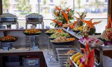 Vibrant buffet display on a Halong Bay cruise with fresh seafood and local dishes, perfect for a sce.
