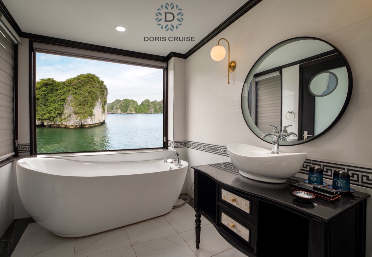 Scenic view of Halong Bay from a luxurious cruise bathroom, showcasing comfort and stunning natural.
