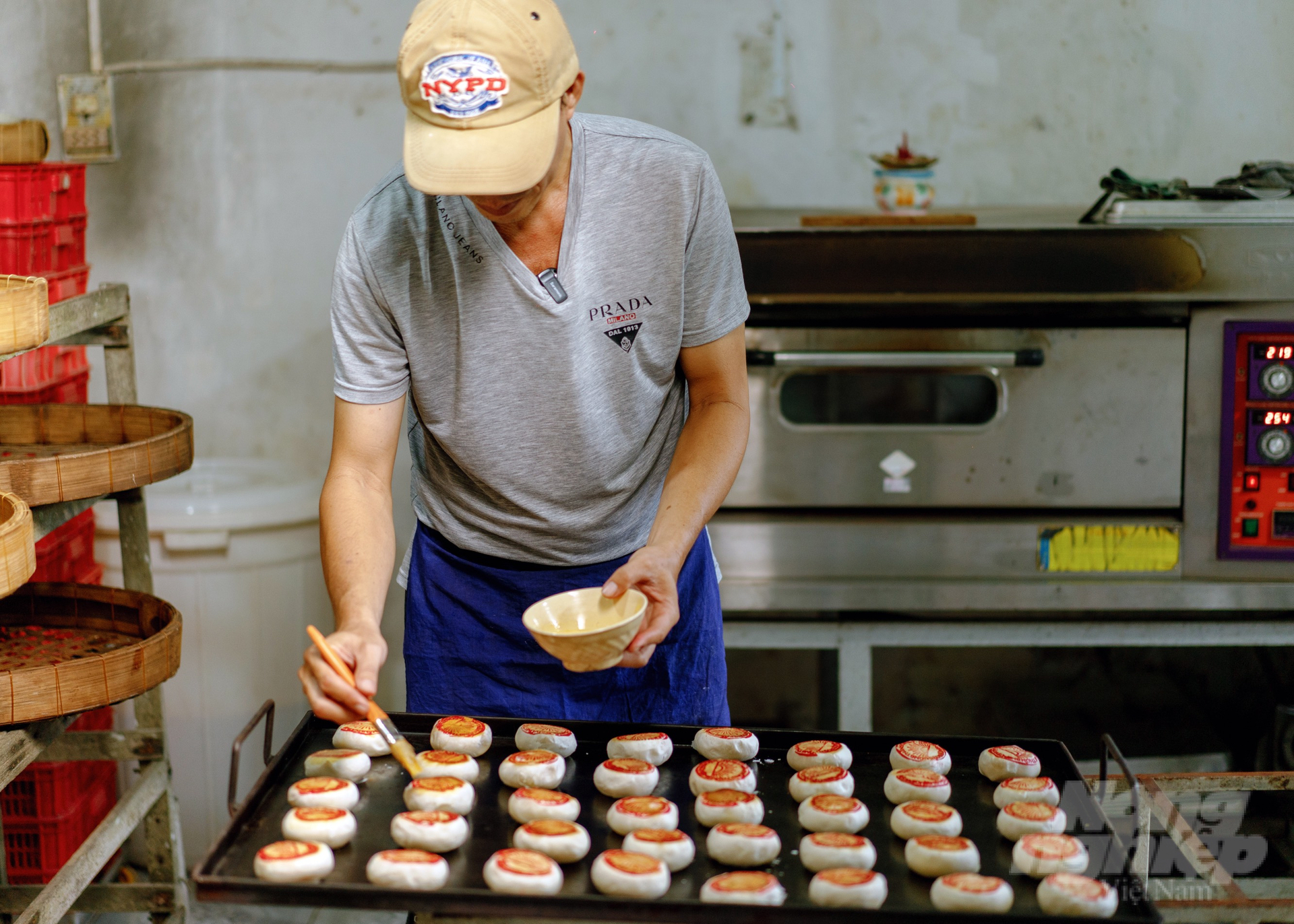 Freshly baked Banh Chung on tray in traditional Vietnamese bakery, showcasing authentic cuisine.