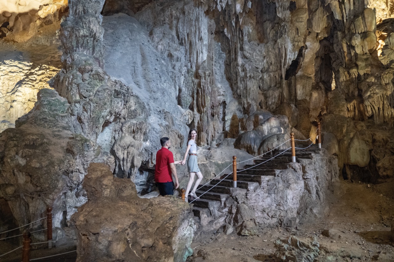 Stalactite cave tour in Vietnam with guided exploration and stunning mineral formations.