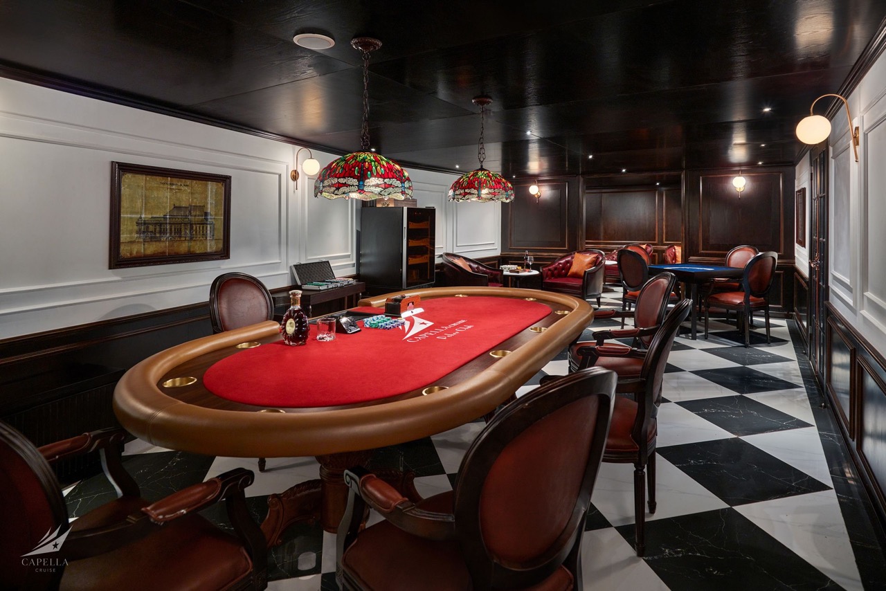 Luxurious casino poker room with elegant decor and classic gaming tables in Vietnam.