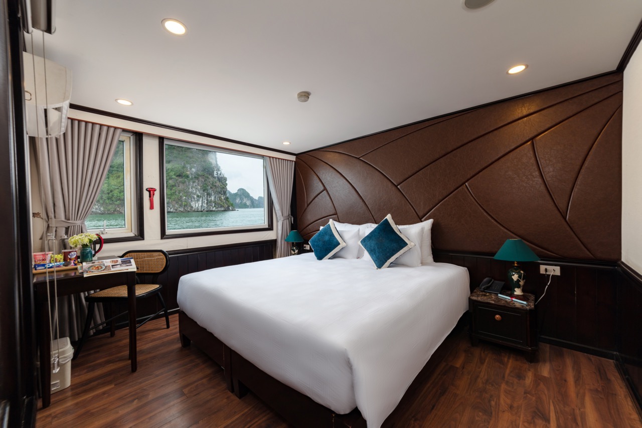 Sea view hotel room with modern decor and comfortable bedding in Vietnam.
