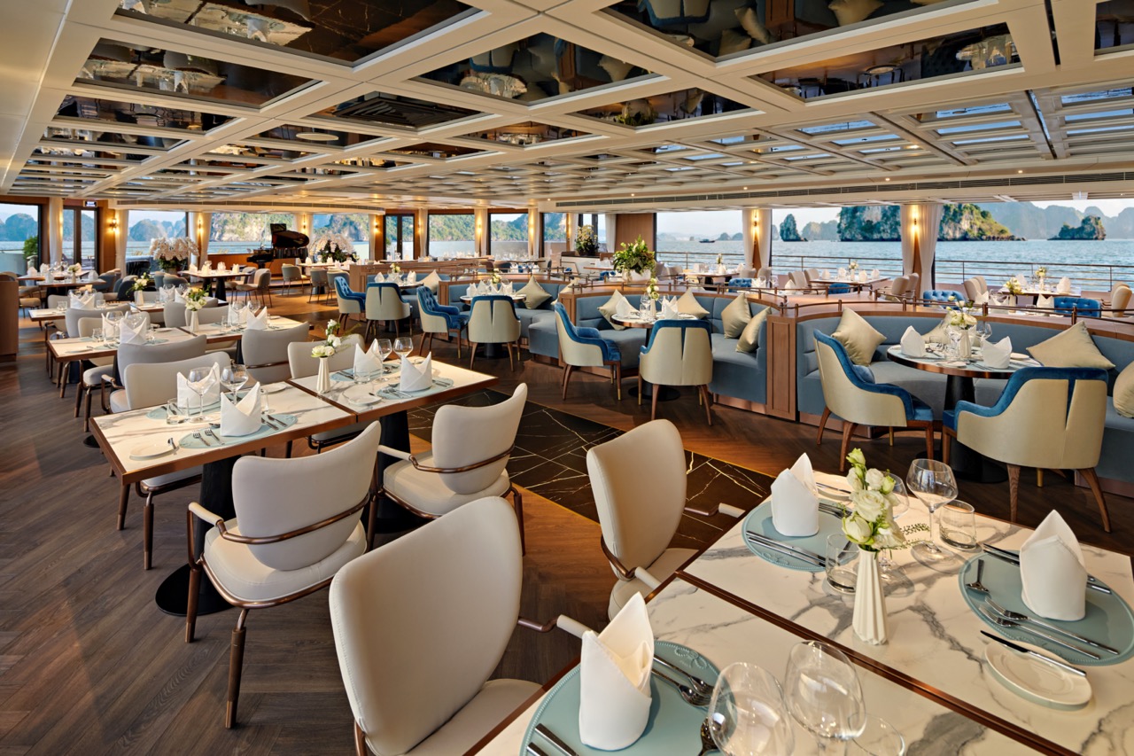 Elegant waterfront restaurant with luxurious decor and panoramic sea views.