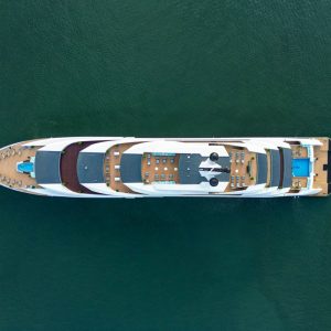 Luxury yacht cruising in emerald waters, perfect for Vietnam island tours and private charters.