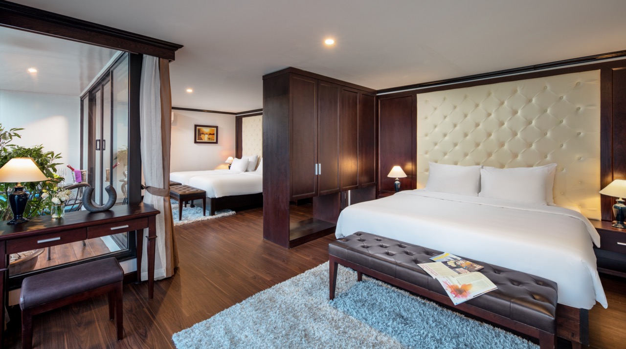 Elegant cruise balcony view of Halong Bay with modern interior and serene atmosphere.