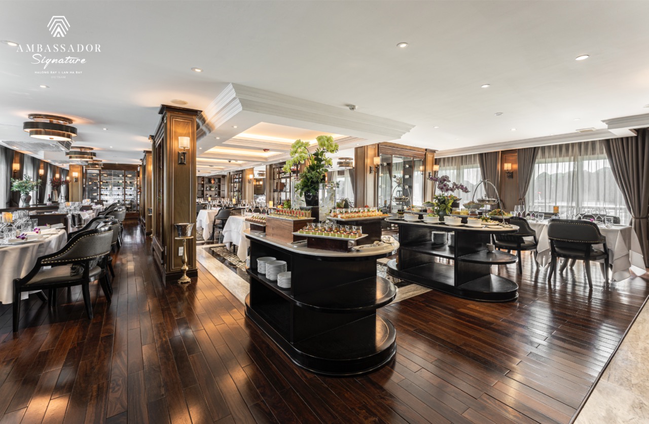 Elegant cruise dining area with sophisticated decor and panoramic windows, perfect for a relaxing Ha.