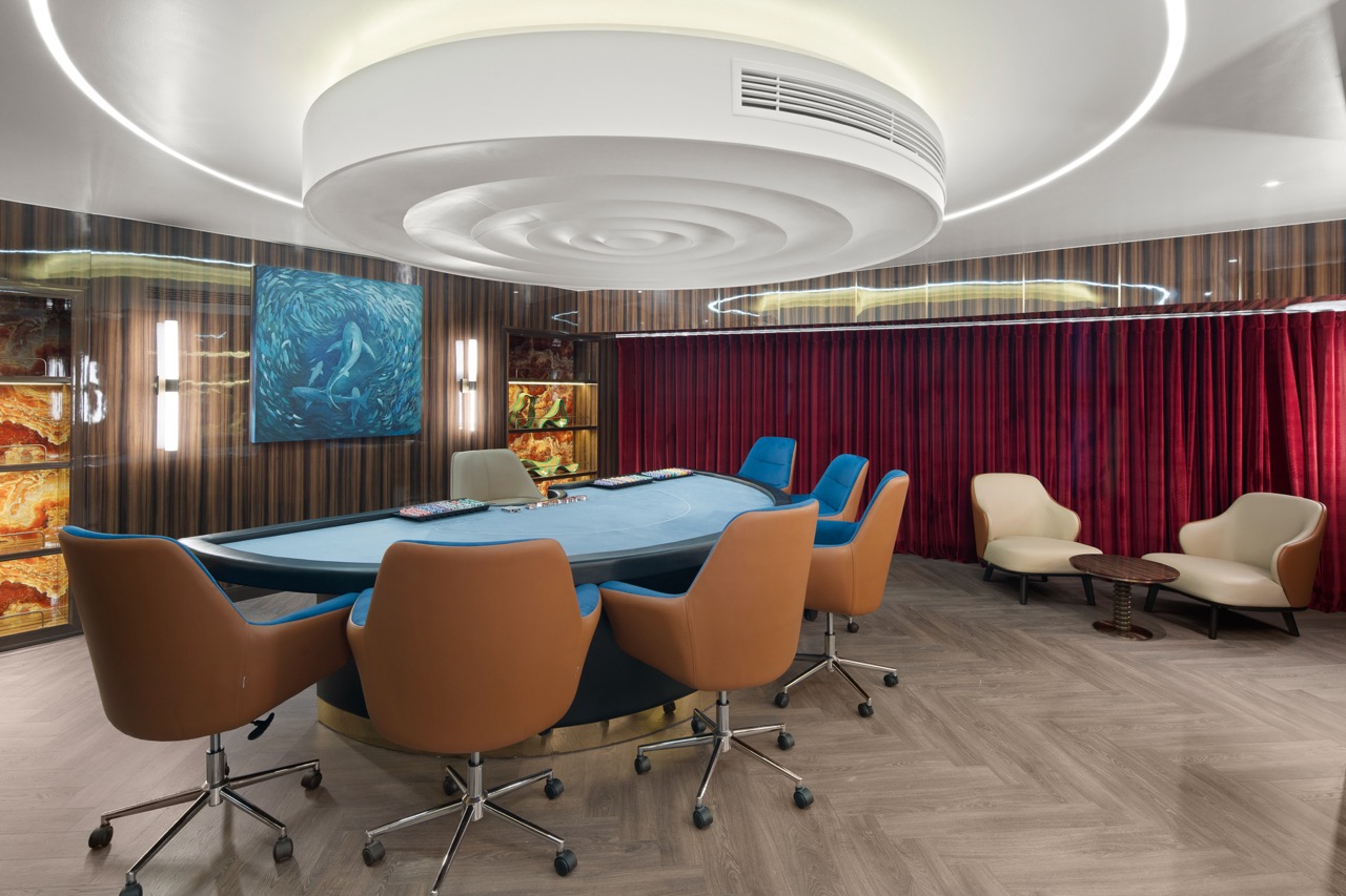 Luxurious poker room with modern design and comfortable seating for high-stakes gaming in Vietnam.