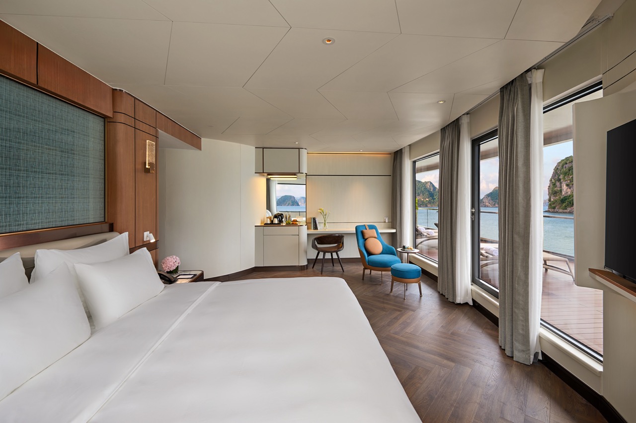 Luxury ocean-view hotel room in Vietnam with modern decor and private balcony.