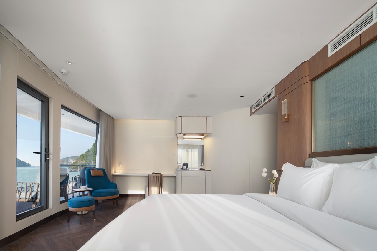 Sea view hotel room with modern interior and balcony, perfect for luxury travel and relaxing vacations.
