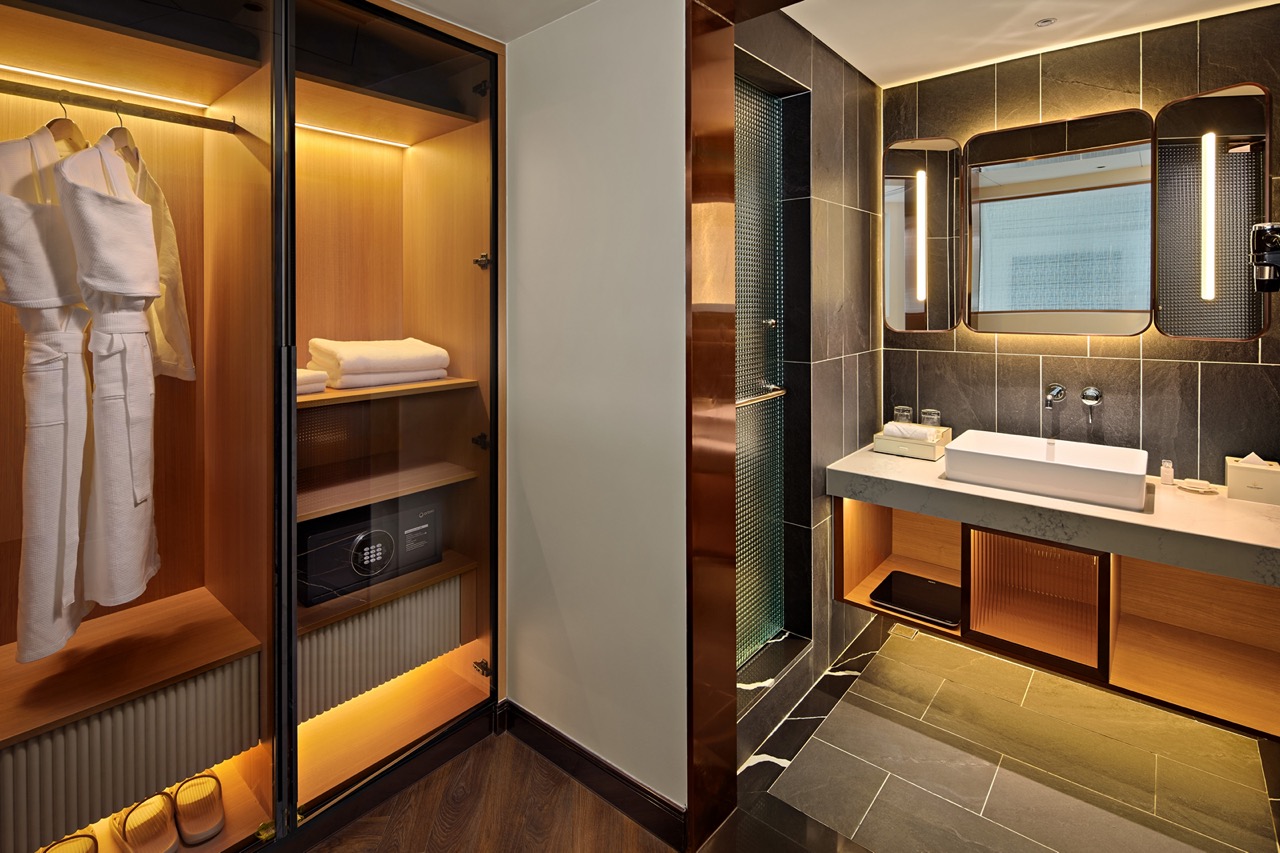 Luxurious hotel bathroom and wardrobe with modern design, perfect for traveler comfort and convenience.