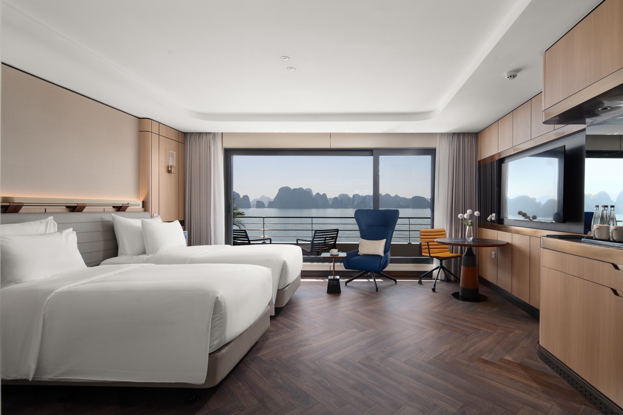 Luxurious hotel room with sea view and modern interior design.