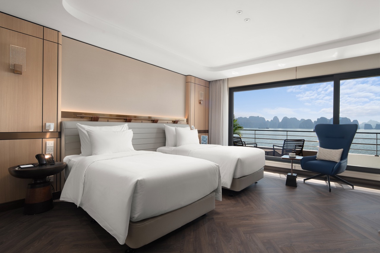 Elegant hotel room with sea view and modern decor, perfect for luxury travelers.