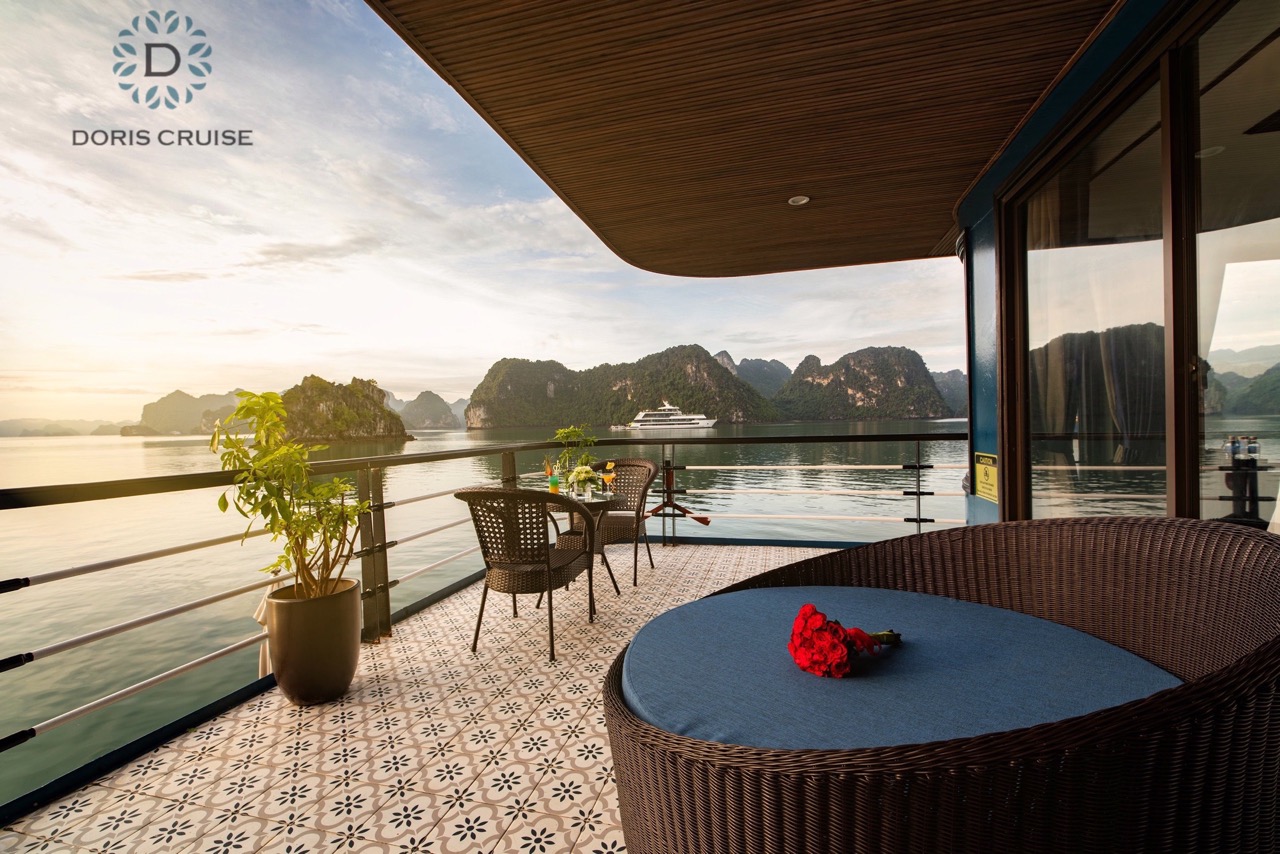 Stunning Halong Bay cruise balcony with panoramic views and serene waters, perfect for a romantic ge.