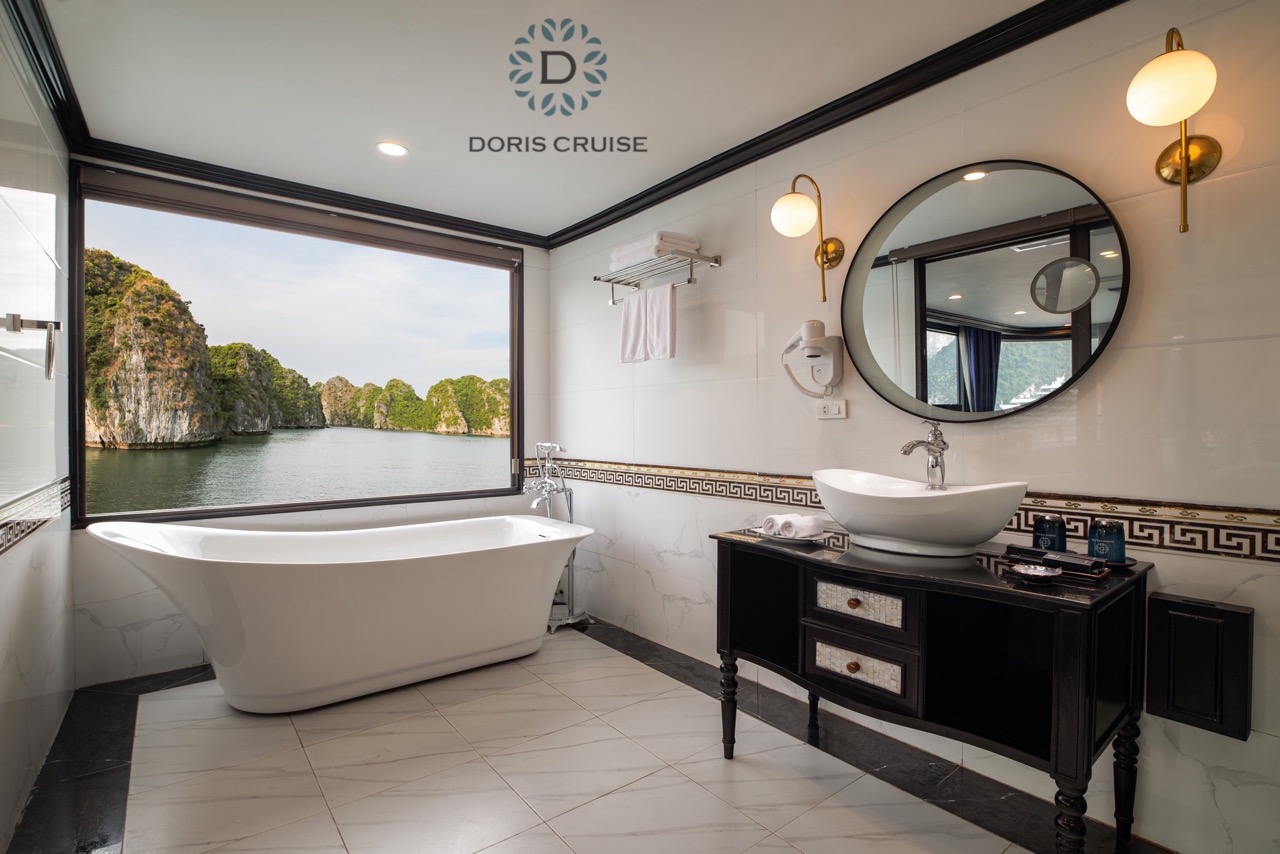 Luxurious bathroom with scenic Halong Bay views, perfect for a relaxing cruise experience.