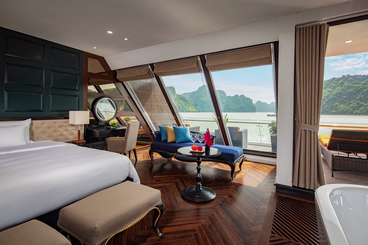 Luxurious hotel room with river view and scenic mountain landscape in Vietnam.