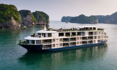 MonCheri Cruise - Elegant cruise ship sailing through stunning Halong Bay scenery, perfect for a 2D1N tour.