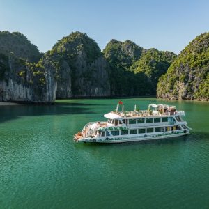 Serenity Cruises side profile in emerald waters.