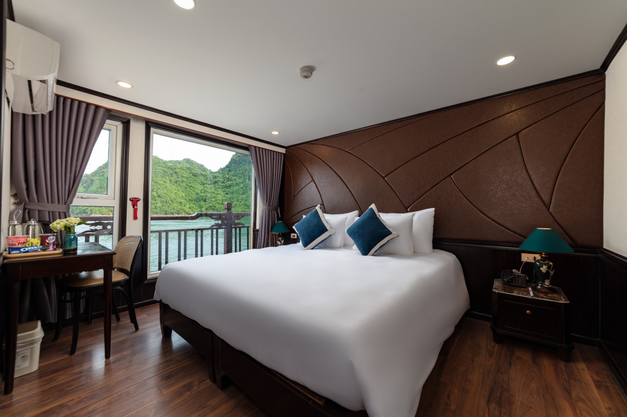 Comfortable hotel room with scenic mountain view in Vietnam.