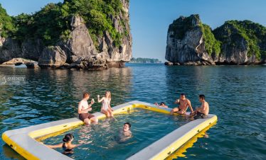 Swimming and relaxing in a scenic Lan Ha Bay setting with limestone karsts in the background.