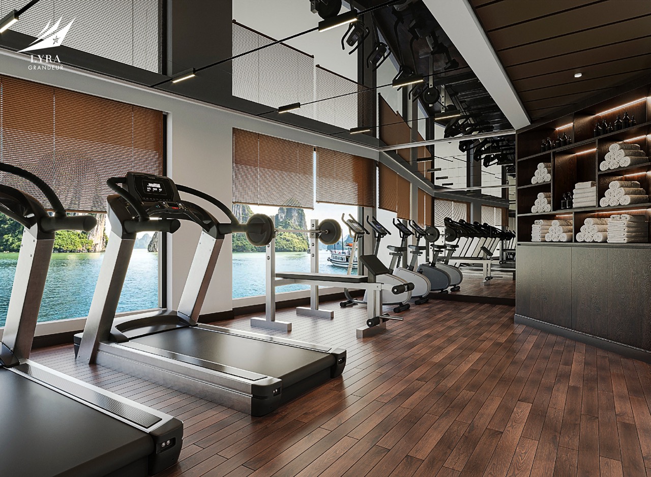 Modern gym with scenic water view, state-of-the-art equipment, fitness room at ViettrendTour.