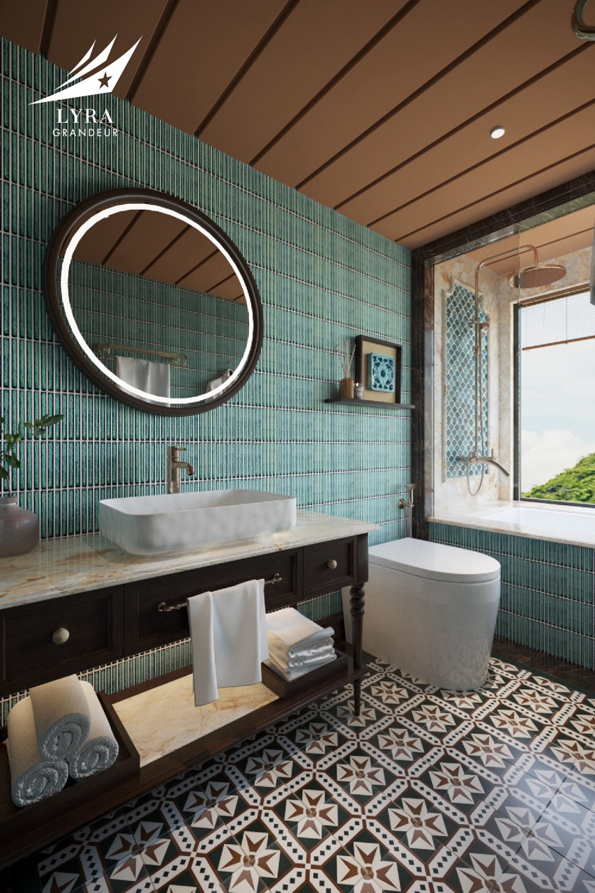 Luxurious bathroom with green tile walls, modern sink, and elegant decor at ViettrendTour resort.