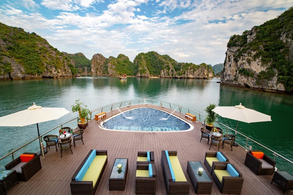Relaxing cruise in Ha Long Bay with private pool and scenic limestone islands.