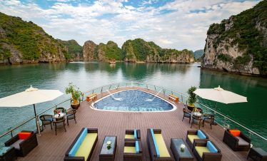 Relaxing cruise in Ha Long Bay with private pool and scenic limestone islands.