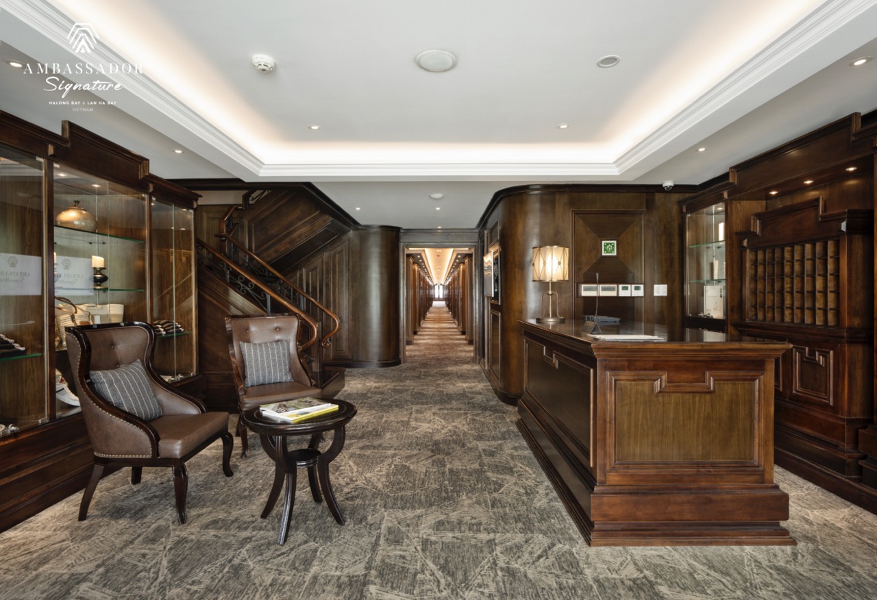 Elegant wooden decor and cozy seating area on a premium cruise experience.