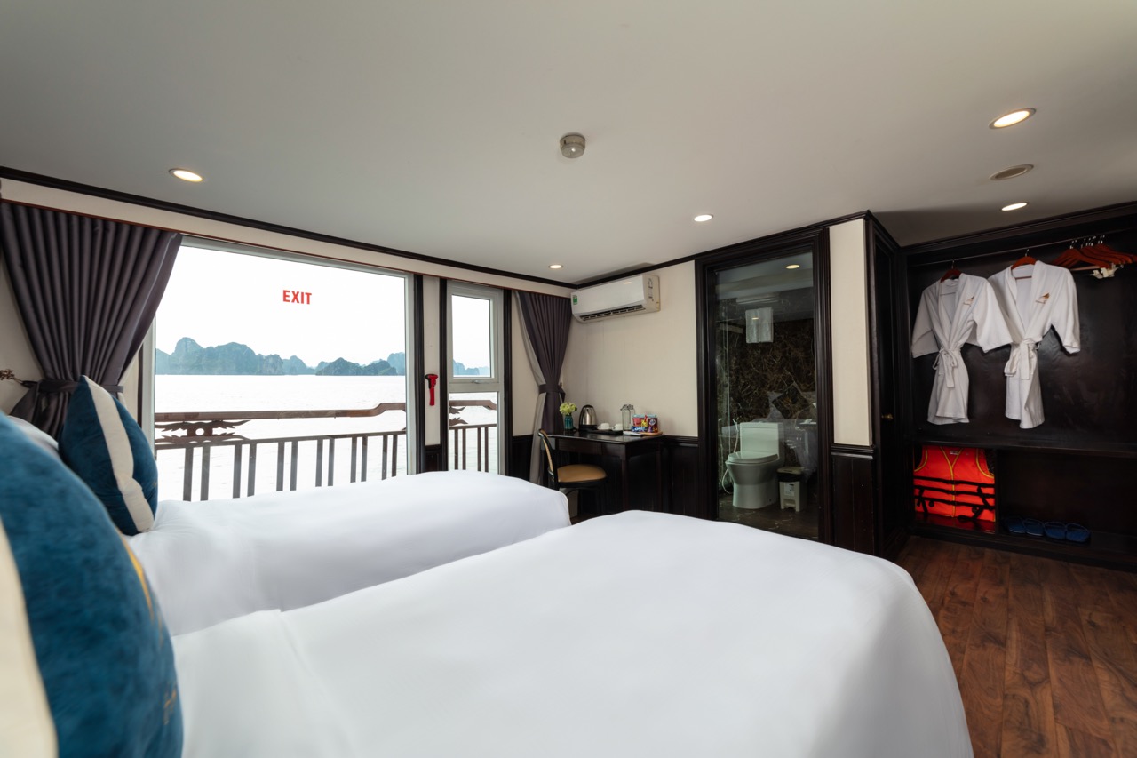 Comfortable hotel room with ocean view balcony in Vietnam Viettrend Tour.