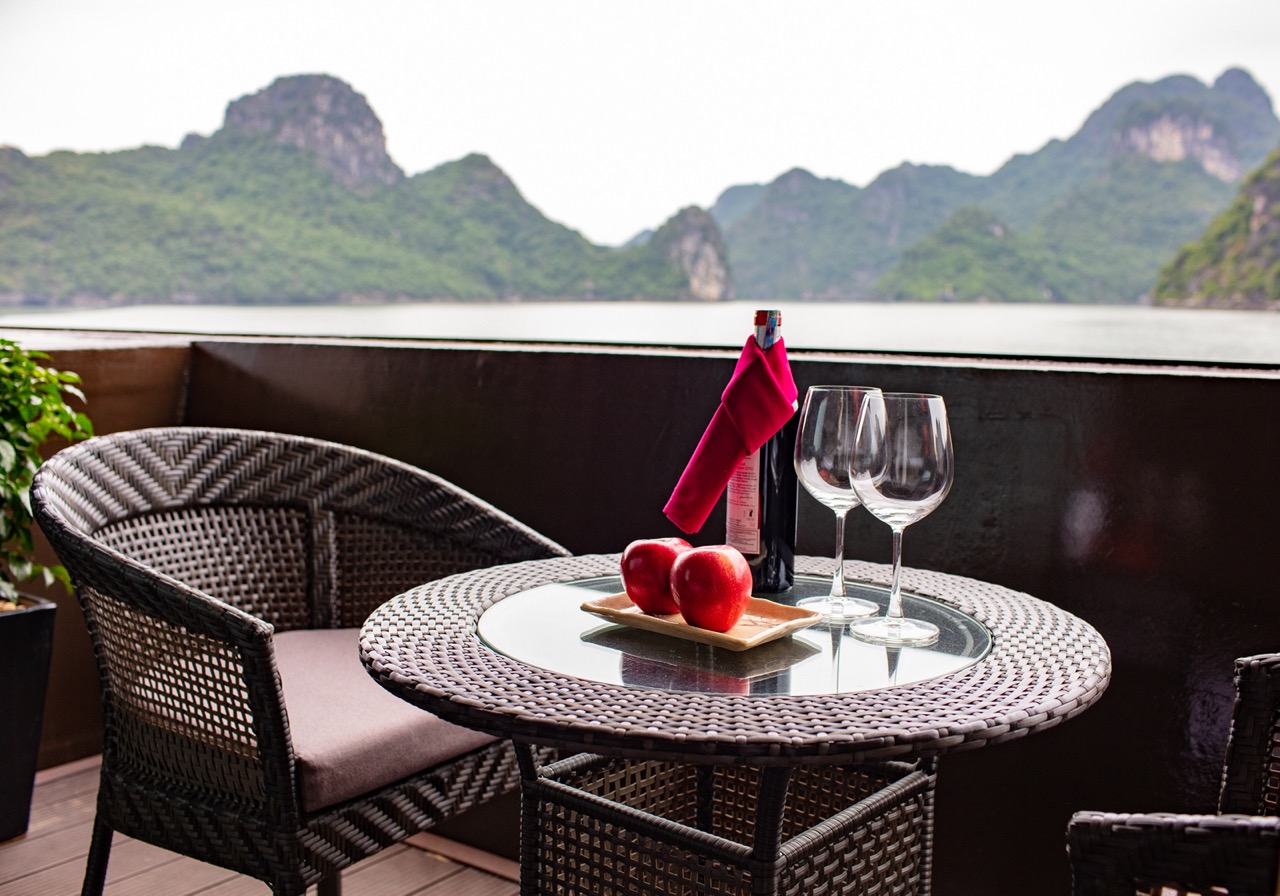 Relaxing balcony dining with scenic lake and mountain views, perfect for romantic dinners in Vietnam.