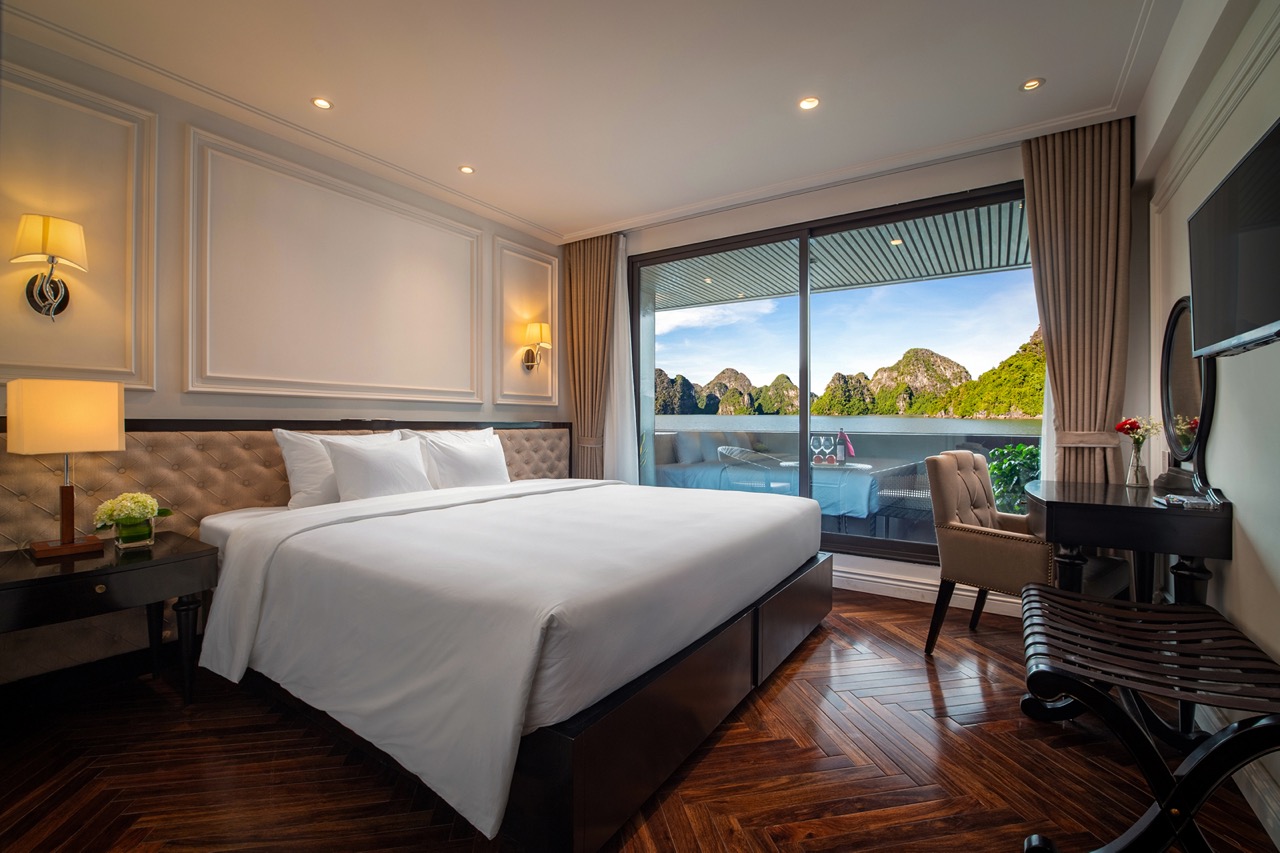 Luxury hotel room with balcony and mountain view, ViettrendTour vacation accommodation.