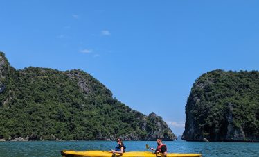 Kayaking in Lan Ha Bay with stunning limestone karsts and clear waters, perfect for a peaceful day e.